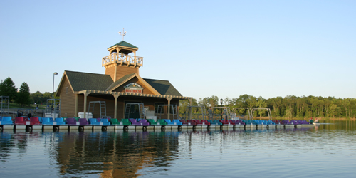 View of a dock and paddle boats at West Fork Lake in Cincinatti, Ohio.